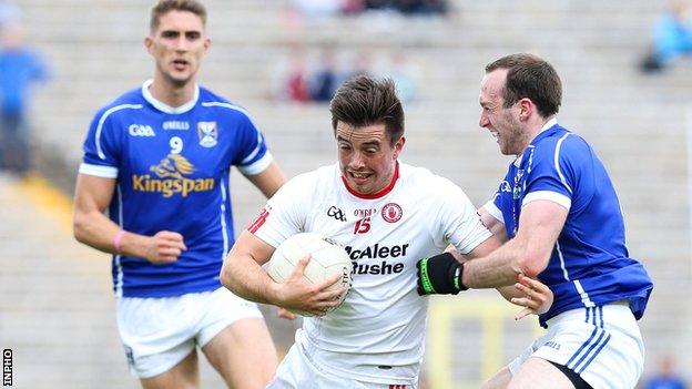 Tyrone forward Ronan O'Neill is tackled by Cavan's Fergal Flanagan in this year's Ulster SFC semi-final replay