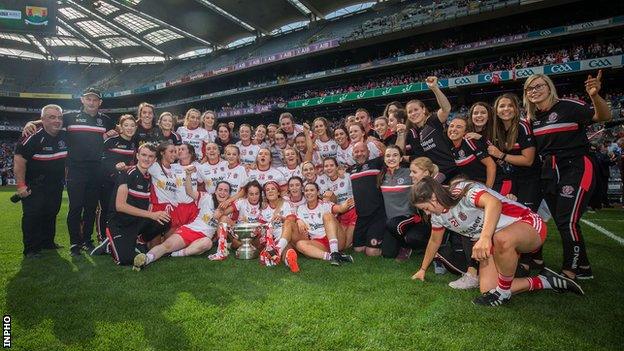 Tyrone's players and management celebrate after the county's All-Ireland Ladies Intermediate Football triumph