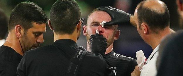 Wayne Rooney's nose is plugged with tissue