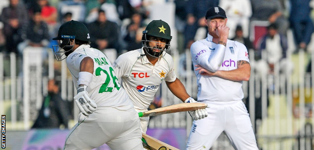 Ben Stokes looks on as Pakistan's openers run a single