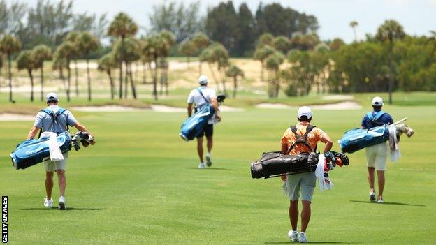 The players (l-r) McIlroy, Johson, Fowler and Woolf all carried their own bags with caddies not allowed