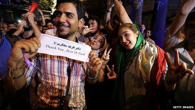 Iranians celebrate after Iran's nuclear negotiating team struck a deal with world powers in Vienna, on 14 July, 2015