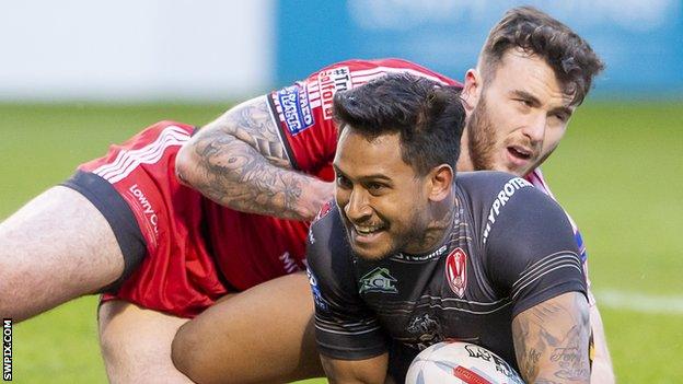 St Helens full-back Ben Barba (right) crosses to score one of his three tries against Salford Red Devils at the AJ Bell Stadium