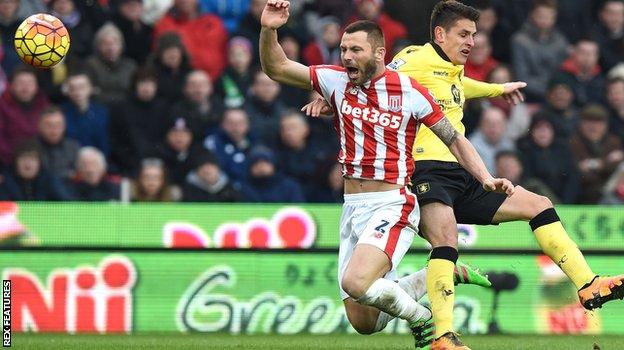 Ashley Westwood brings down Phil Bardsley for a penalty