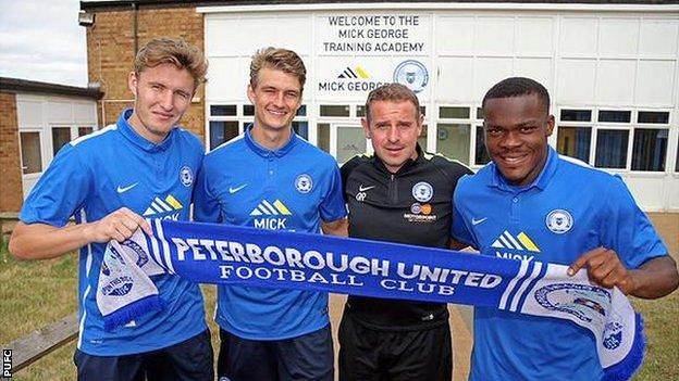 From left: Keiran Sadlier, Andrew Fox, PUFC manager Dave Robertson, Souleymane Coulibaly.