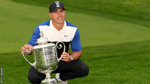 American Brooks Koepka poses with the PGA Championship trophy after winning the 2019 tournament