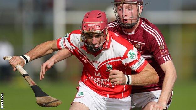 Liam Watson of Loughgiel in action against Cushendall's Eoghan Campbell