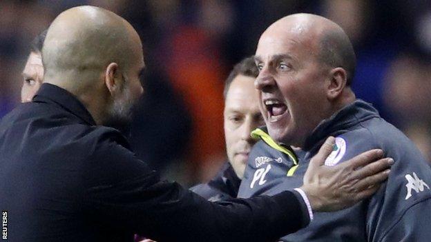 Wigan manager Paul Cook (right) argues with Pep Guardiola during Wigan's shock FA Cup fifth round win over Manchester City