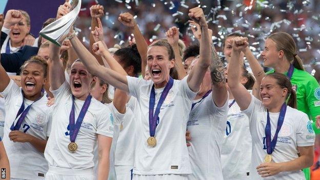 Jill Scott and the Lionesses lift the European Championship trophy at Wembley.