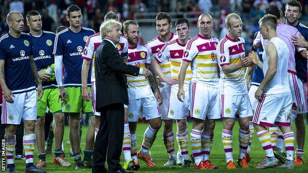 Scotland manager Gordon Strachan congratulates his players in Portugal