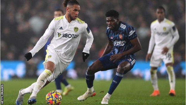 Leeds' Tyler Roberts runs with the ball