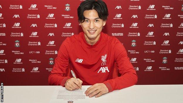 Takumi Minamino signing terms with the Premier League leaders on Wednesday