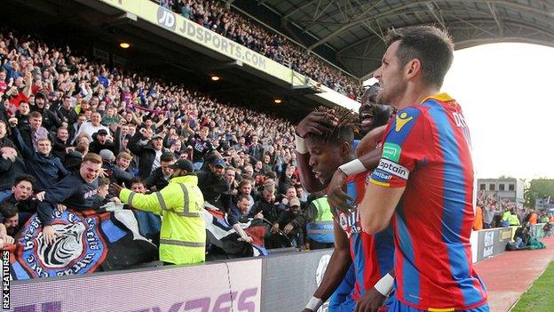 Wilfried Zaha celebrates with team-mates