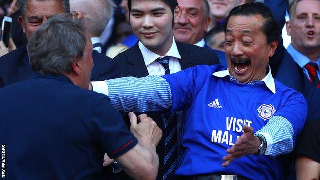 Cardiff City owner Vincent Tan celebrates with manager Neil Warnock after the Bluebirds sealed promotion back to the Premier League.