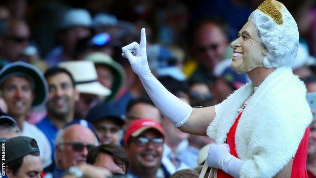 A supporter dressed as the Queen addresses the crowd during the first Test at the Gabba