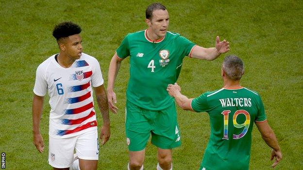 John O'Shea is congratulated by Republic of Ireland team-mate Jonathan Walters as he ended his international career after 118 caps