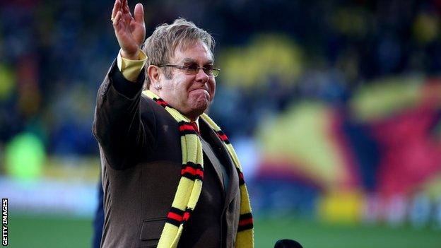 Elton John waves to fans at Vicarage Road