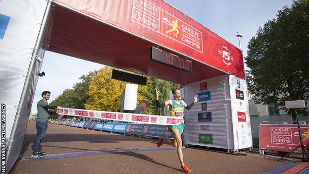 Jack Rayner crosses the finish line in the Cardiff Half Marathon