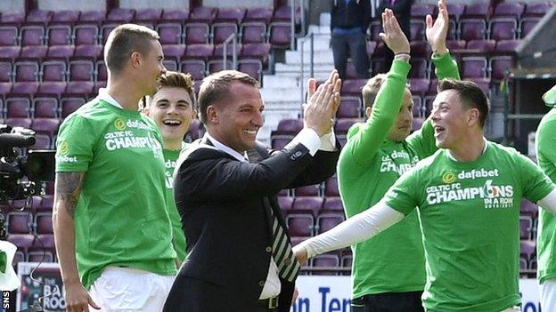 Mikael Lustig (left) celebrates with Celtic manager Brendan Rodgers and his team-mates