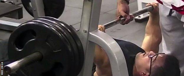 A paralympic weightlifter trains in a gym