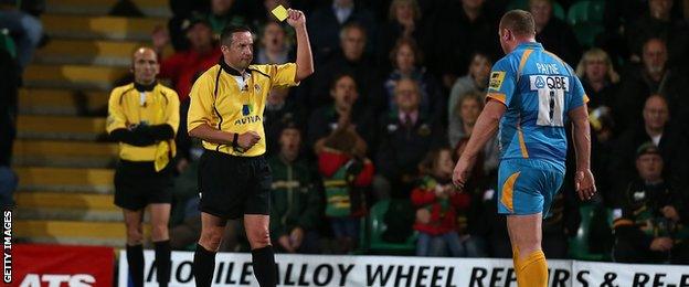 Dave Pearson shows London Wasps prop Tim Payne a yellow card