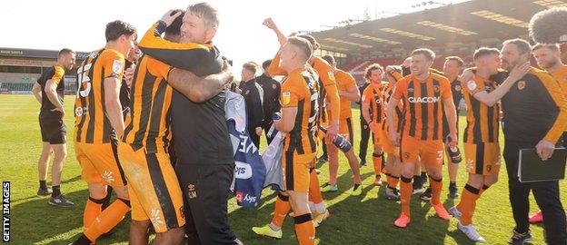 Grant McCann celebrates with his players after promotion