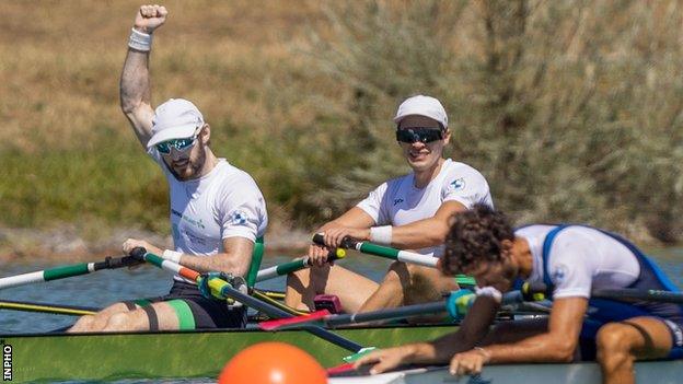 Paul O'Donovan (left) celebrates and he and Fintan McCarthy clinched gold in Munich