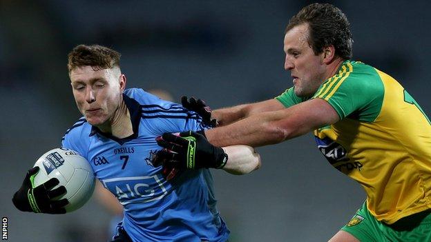 Michael Murphy battles with Dublin's John Small before his sending off