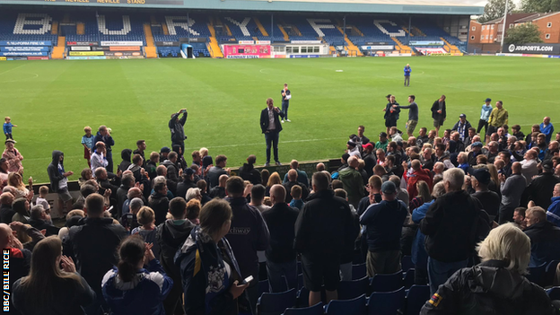 James Frith MP speaks to fans at Gigg Lane, Bury