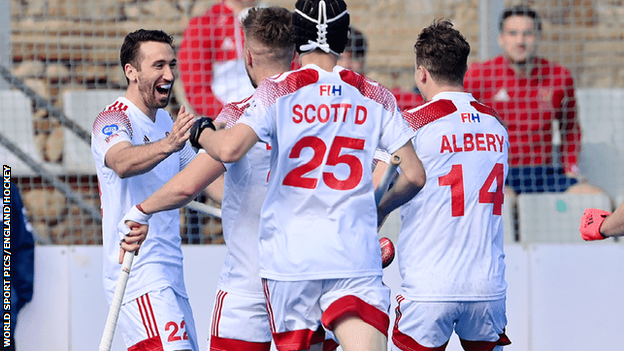 David Condon celebrates scoring with team-mates