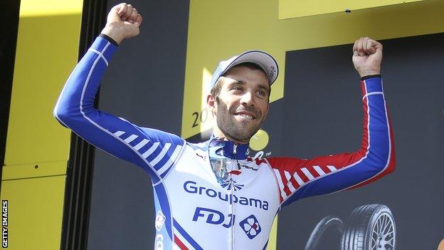 Thibaut Pinot celebrates on the podium after winning stage 14