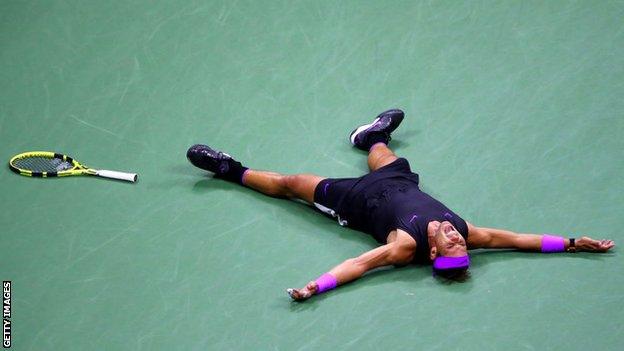 Rafael Nadal lies down on Arthur Ashe Stadium after winning the 2019 US Open final