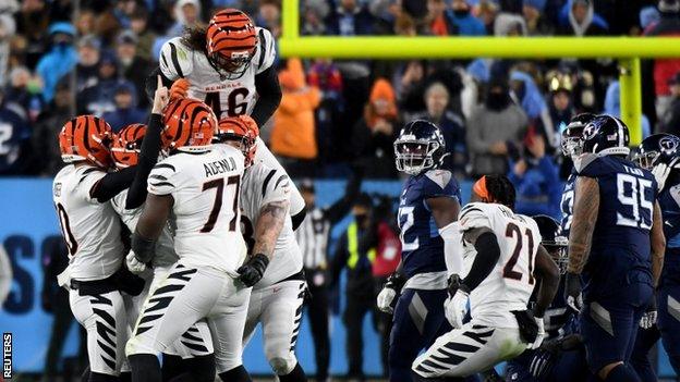 Evan McPherson celebrates a game-winning field goal with his Cincinnati Bengals team-mates