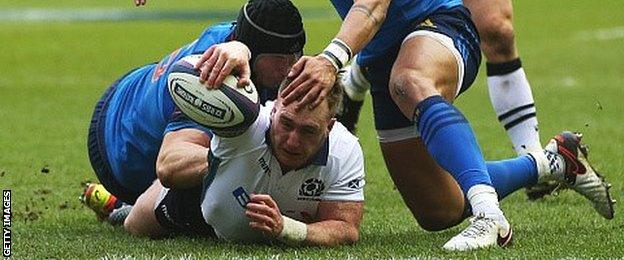 Stuart Hogg stretches over to score Scotland's first try