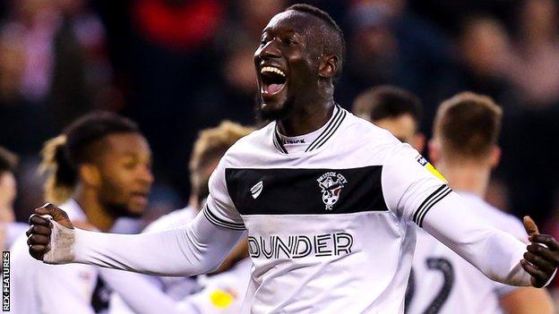 Famara Diedhiou celebrates his goal for Bristol City at Nottingham Forest