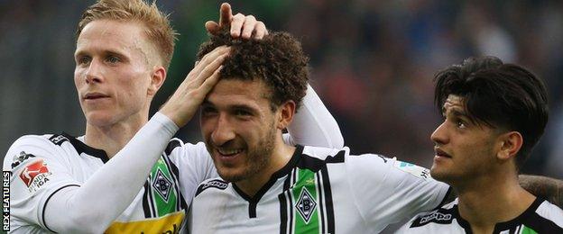 Gladbach celebrate a goal from Fabian Johnson (centre)