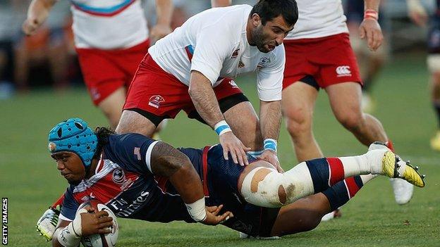 Joe Taufete'e of the United States is tackled by Russia's Nazir Gasanov at Bonney Field, Sacramento, California, June 2016