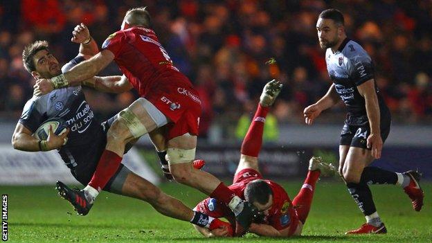 Toulon flanker Facundo Isa is stopped in his tracks by the Scarlets defence