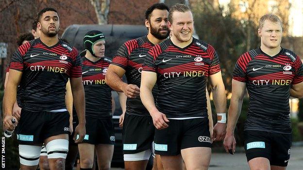 Saracens walk from the changing room to the pitch at Ealing