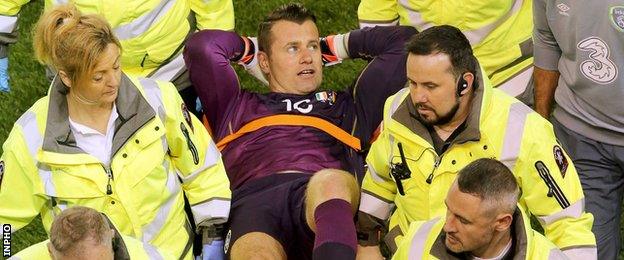 Shay Given is stretched off during the Republic's win over Germany in October