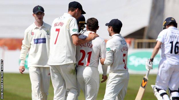 Andrew Salter is congratulated after taking a wicket (pictures from the correct day, not archive)