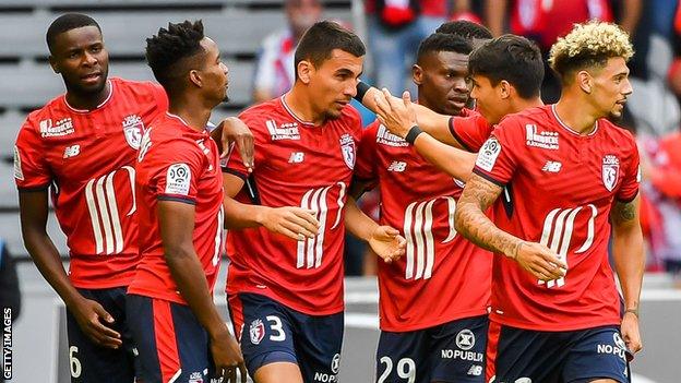 Lille players celebrate scoring against Nantes on August 6 2017