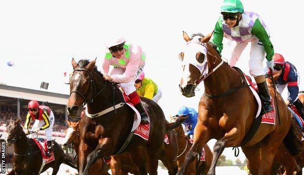 Frankie Dettori (pink) in second looks over at winner Michelle Payne and Prince Of Penzance