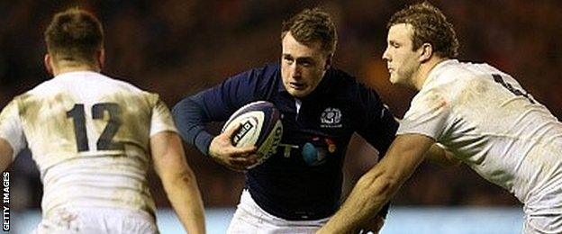 Stuart Hogg tries to evade Owen Farrell (left) and Joe Launchbury