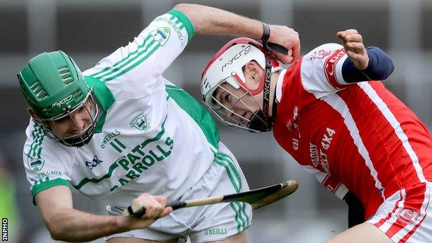 Cuala's Oisin Gough battles with O'Loughlin Gaels' Mark Kelly at Portlaoise