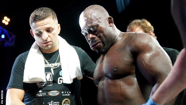 Melvin Manhoef in tears after leaving the cage