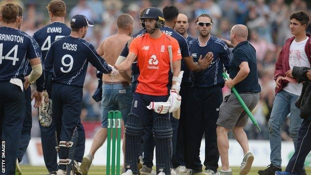 England's Mark Wood shakes hands with Scotland's players after their shock defeat by Scotland