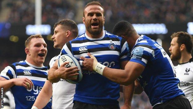 Bath centre Jamie Roberts (centre) celebrates scoring a try against Bristol