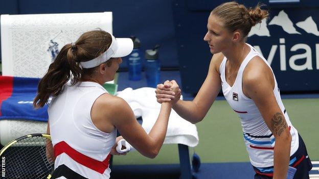 Johanna Konta and Karolina Pliskova shake hands at the end of their US Open fourth-round match on Sunday