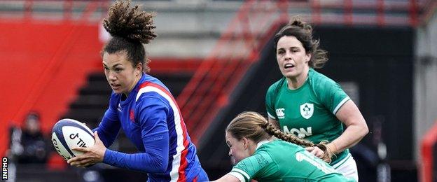 France fly-half Caroline Druin is tackled by Nicole Cronin